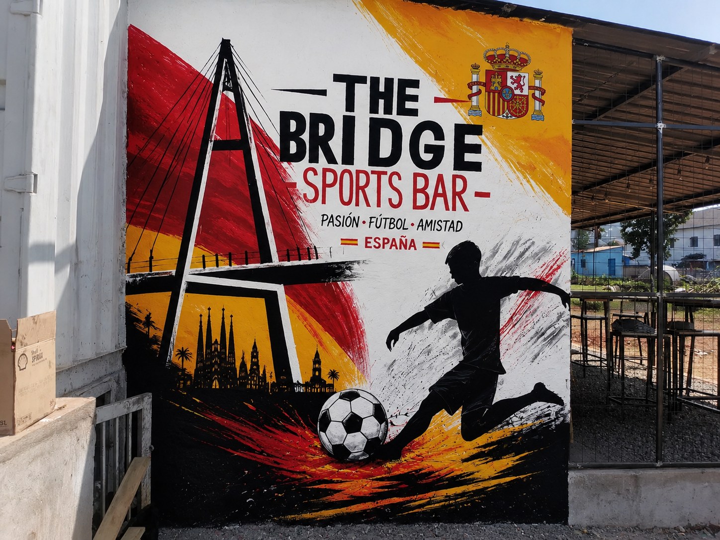 Colourful Spanish-inspired wall art outside Bridge Sports Bar